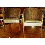 A pair of gold painted Lloyd Loom style tub back chairs (2).