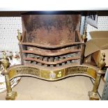 An early 20th century brass and iron fire grate, 77cm wide.