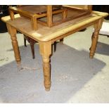 A 19th century pine rectangular kitchen table, on turned supports, 128cm wide.