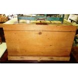 A 20th century pine rectangular lift top trunk. 82cm wide.