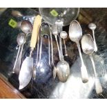 A quantity of silver spoons and plated tongs.