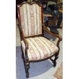 A pair of 19th century mahogany framed upholstered open armchairs.