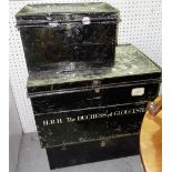 A group of three black metal trunks, two stencilled with the name 'HRH The Duchess of Gloucester',