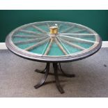 A bijouterie table, the revolving segmented cartwheel top with perspex cover,
