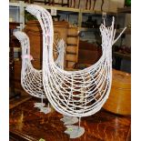 A graduated pair of 20th century wicker and metal geese garden ornaments.