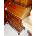 An Edwardian satinwood banded mahogany bureau, with three drawers, 76cm wide.