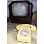 An early 20th century Bush television (sold as seen) and a Bakelite telephone,