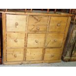 A 20th century pine chest of ten various drawers, 130cm wide.