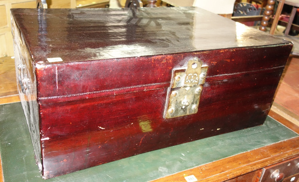 A 20th century Chinese rectangular lacquer trunk 85 cm wide, and a birdcage, (2).