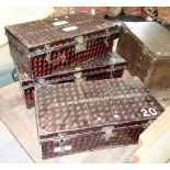 Three metal trunks with tortoiseshell painted decoration and gold inner,