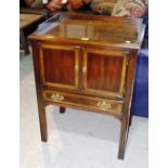 A 20th century mahogany bedside cabinet with pair of cupboards and drawer. 58cm wide.