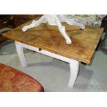 A pine coffee table with white painted base, 100cm wide.