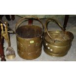 A 19th century copper log bucket, a helmet shaped coal scuttle and a small quantity of fire tools,