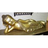 A 20th century gilt fibre glass model of a reclining Buddha, 129cm.