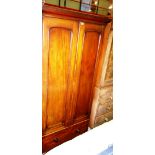 A Victorian mahogany two door wardrobe, with single drawer base, 101cm wide x 203cm high.
