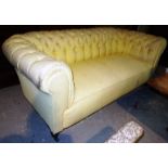 A Victorian Chesterfield sofa, on turned walnut supports, 200cm wide.