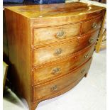 A Regency mahogany bowfront checkered stained chest, of two short and three long graduated drawers,