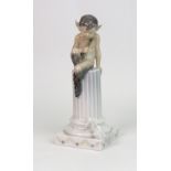 A Royal Copenhagen figure, Faun on column with squirrel, no. 456.