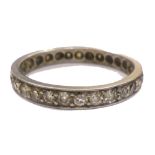 An early 20th century diamond eternity ring, the 29 old cut stones approximately 1.
