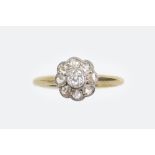 An early 20th century gold and diamond cluster ring, centred with an old cut diamond approx. 0.