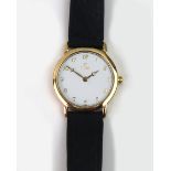 Titan: A lady's gold wristwatch, with circular dial, Arabic numerals, stamped gold, 9K,