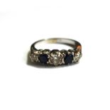 A sapphire and diamond five stone ring, the three round brilliant diamonds approx. 0.