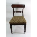 A set of five late Regency mahogany dining chairs, with panelled curved top rails, tablet bar backs,