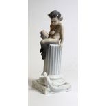 A Royal Copenhagen figure, Faun on a column with squirrel, no. 456.