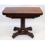 A William IV rosewood fold over top card table, with scroll carved frieze,