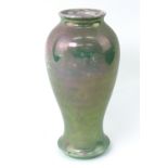 A William Moorcroft green lustre baluster vase, impressed to base 'Moorcroft M44, Made in England',