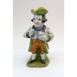 A Faience Toby jug, 20th century, modelled as the Prince Regent eating sweets,