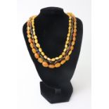 Four rows of irregular amber beads,