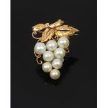 A Mikimoto cultured pearl and yellow metal brooch, in the form of a stylised fruiting vine,