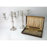 A pair of George III style electroplate three-light candelabrum,