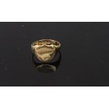 An early 20th century 18ct gold shield-shaped signet ring, Birmingham 1915, 6.4gms.