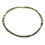 A modern 9ct bi-colour gold and blue topaz necklace,