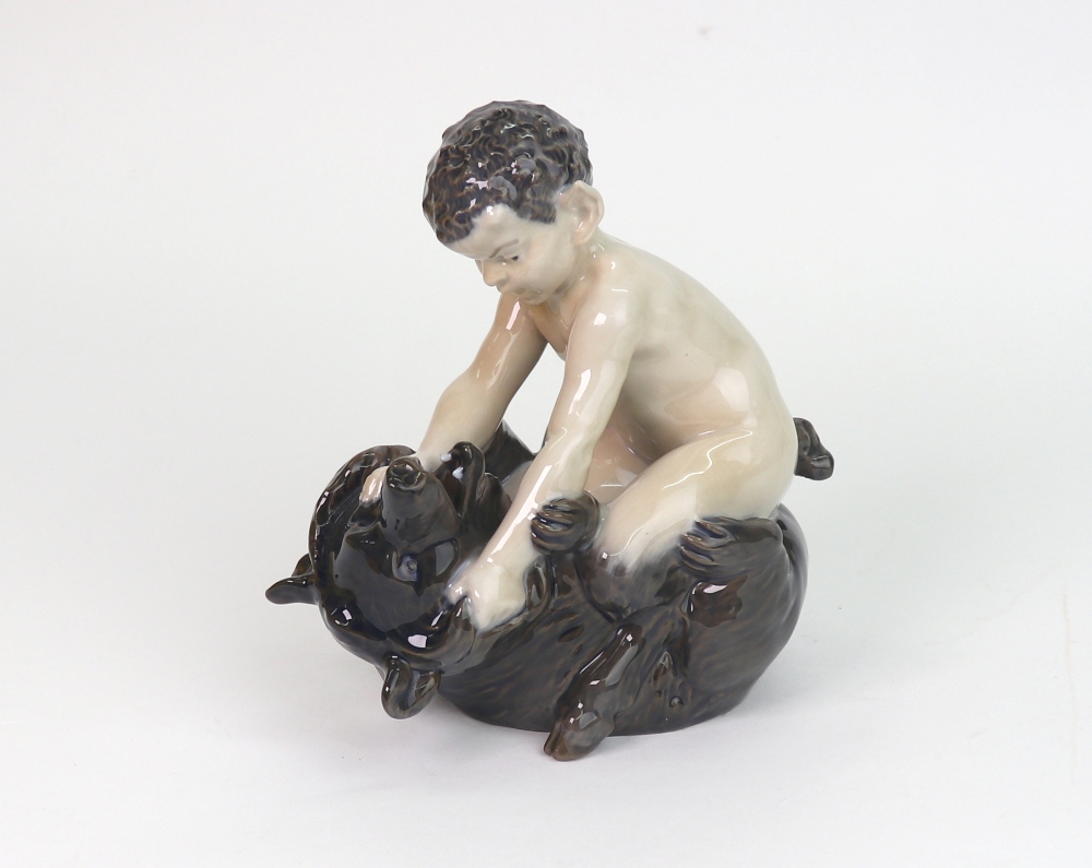 A Royal Copenhagen figure, Faun wresting bear, no.