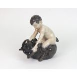 A Royal Copenhagen figure, Faun wresting bear, no.