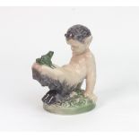 A Royal Copenhagen figure, Faun with frog on knees, no. 1713.