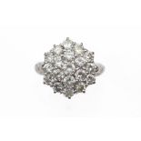 An 18ct white gold and diamond cluster ring, the nineteen round brilliant stones approx. 2.