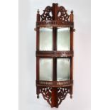 A set of late Victorian mahogany bowfront hanging three tier corner wall shelves,