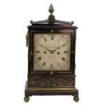 Thwaites & Reed, London; A Regency ebonised and brass mounted mantel clock,