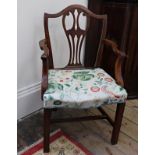 A George III and later mahogany elbow chair, with arched pierced splat back, stuff over seat,