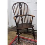 A Victorian beech and elm Windsor elbow chair, with pierced splat,