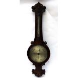 Salom & Co Edinburgh & London; a Victorian figured walnut cased wheel barometer thermometer,