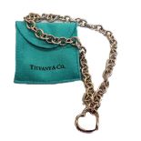 An oval belcher link necklace by Tiffany & Co, the front designed as a heart shaped hinged clasp,