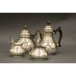 A four-piece silver tea and coffee service, in early 18th century style, Richard Comyns,