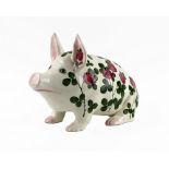 A large Plichta 'Clover' pattern pig, profusely painted with clover flower heads and foliage,