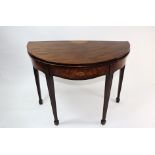A George III mahogany demi-lune tea table, boxwood and ebony strung and tulipwood crossbanded,