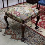 A reproduction George I style mahogany frame square stool, with needlework seat, on cabriole legs,